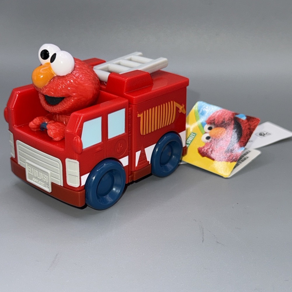 Sesame Street Twist & Pop Wheelies Elmo Fire Truck Vehicle